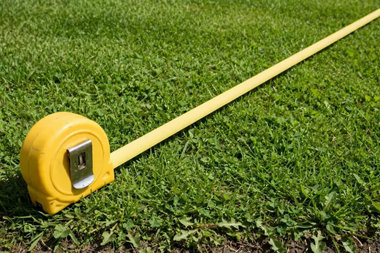 Lawn leveling in progress with a level lawn surface and soil mix